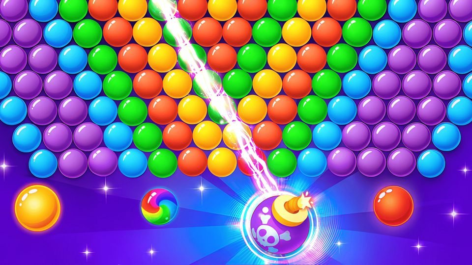 A bubble launcher aims a laser line at a wall of purple, orange, green and blue bubbles.